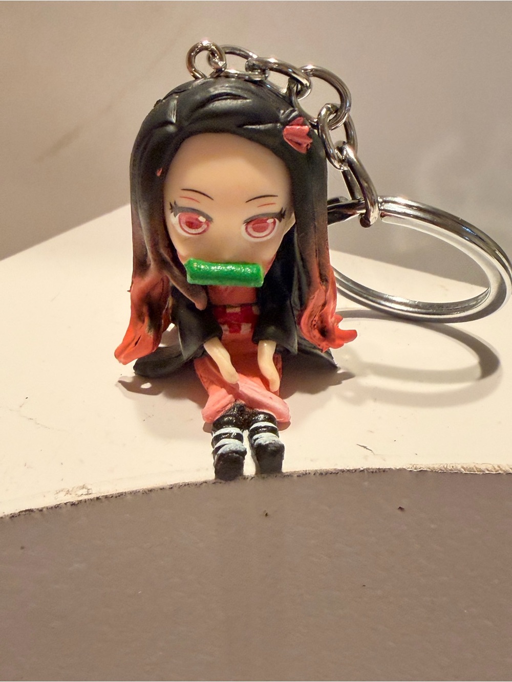 Cute Pink & Black Anime Doll Keychain with Green Accent